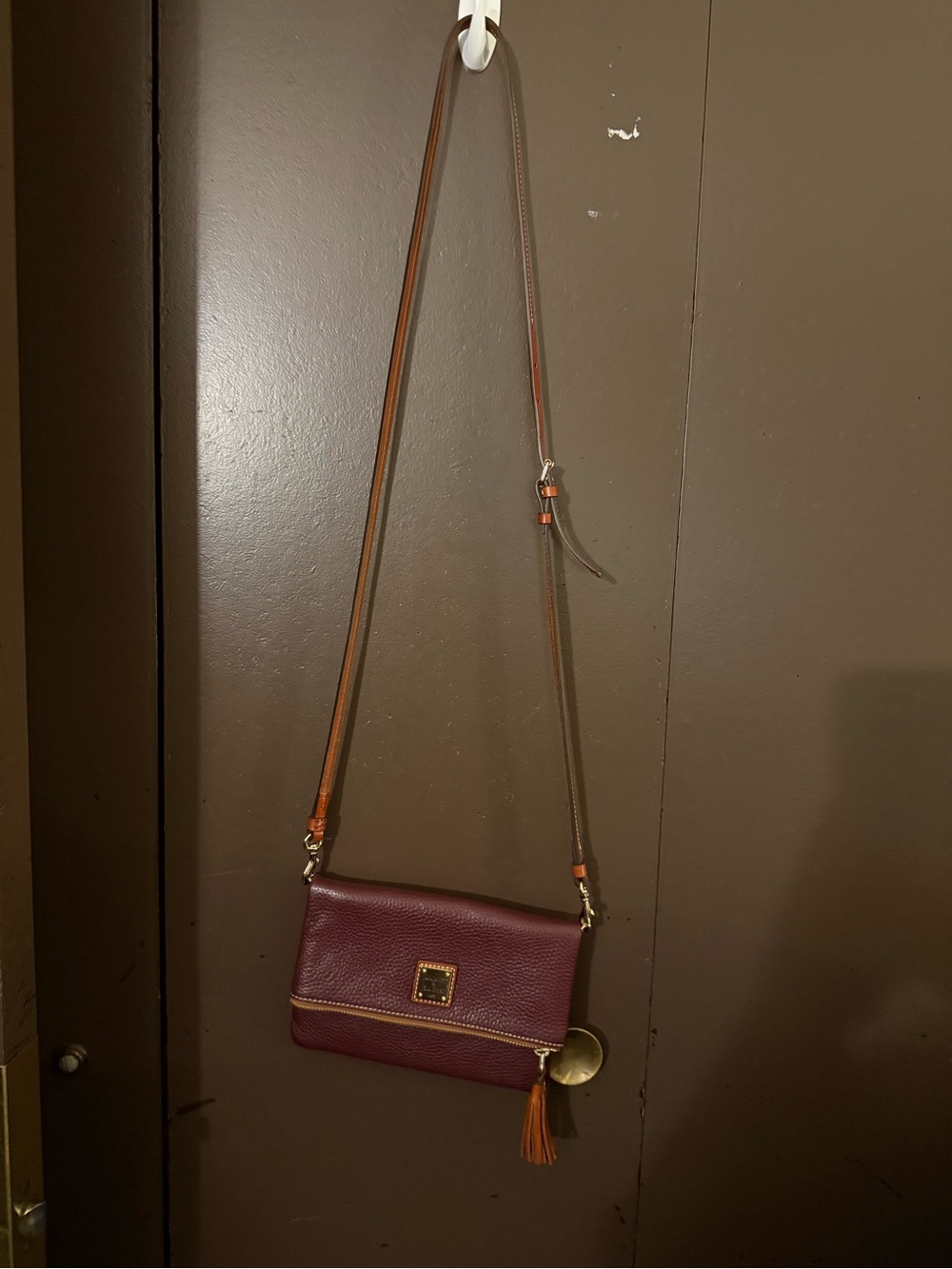 Dooney & Bourke Burgundy Pebbled Leather Crossbody with Tassel Charm